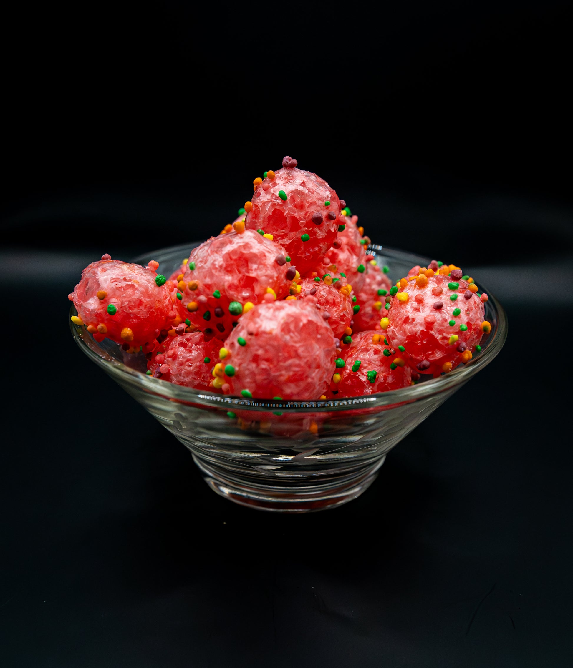 Crunchy Covid Clusters candies exploding with colorful flavor particles.